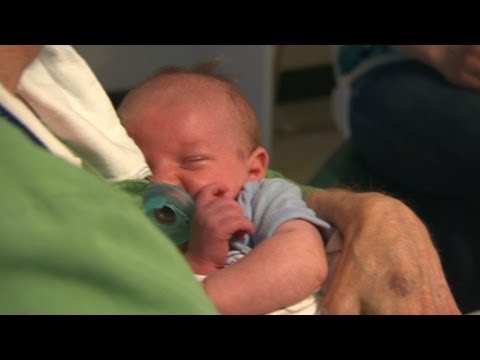 Volunteer 'cuddlers' comfort babies